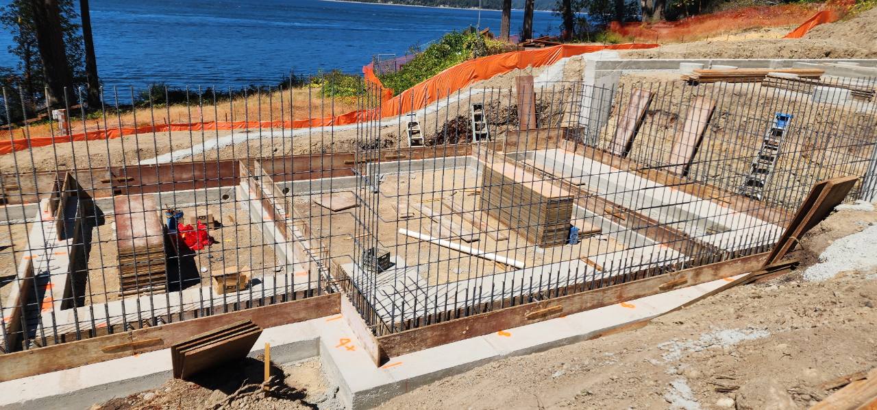 Steel rebar and concrete footings for a large foundation beside the water
